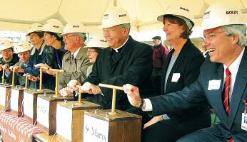 photo of officials detonating dirt explosions during Madison groundbreaking for St. Marys Hospital Medical Center expansion