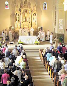 photo of Bishop Robert C. Morlino presiding at centennial Mass at St. James Parish in Madison