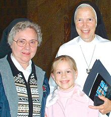 photo of Mother Assumpta Long, right, Sr. John Rose Acker and nine-year-old Bridget Ruhle