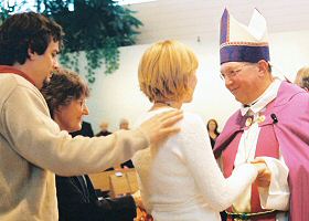 photo of catechumens, candidates and sponsors greeting Bishop Robert C. Morlino