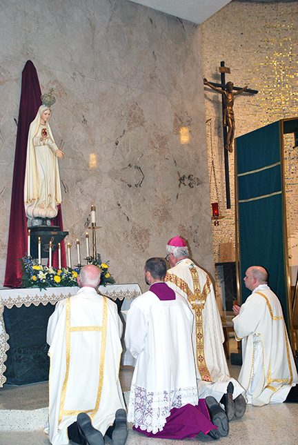 Bishop prays for consecration of Russia and Ukraine.